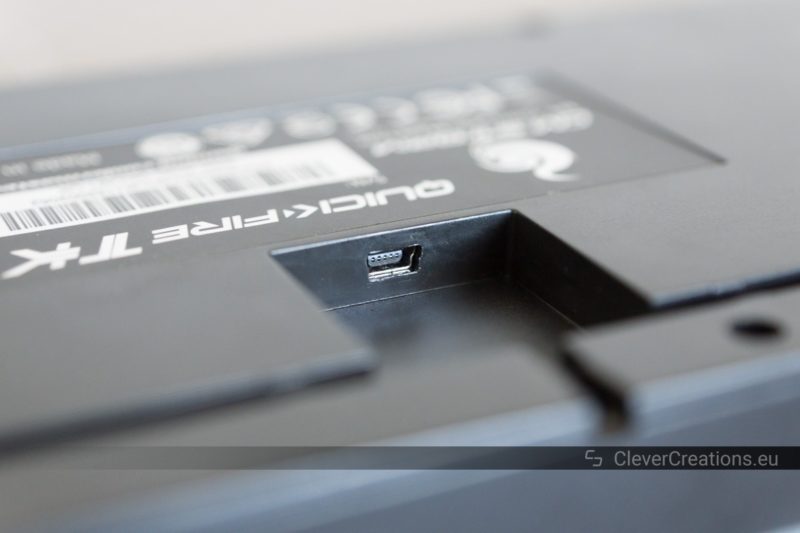 Close-up of the mini-USB connector on the bottom of a Cooler Master Quickfire TK keyboard.