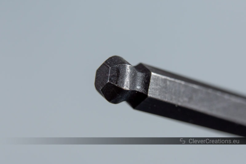 Macro shot of a ballpoint end on the end of an Allen wrench.
