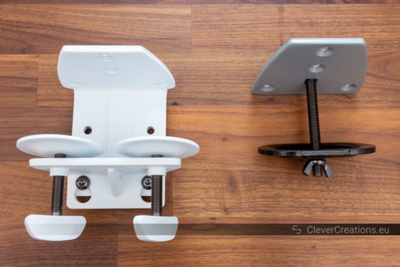 A monitor arm clamp next to a grommet mount.