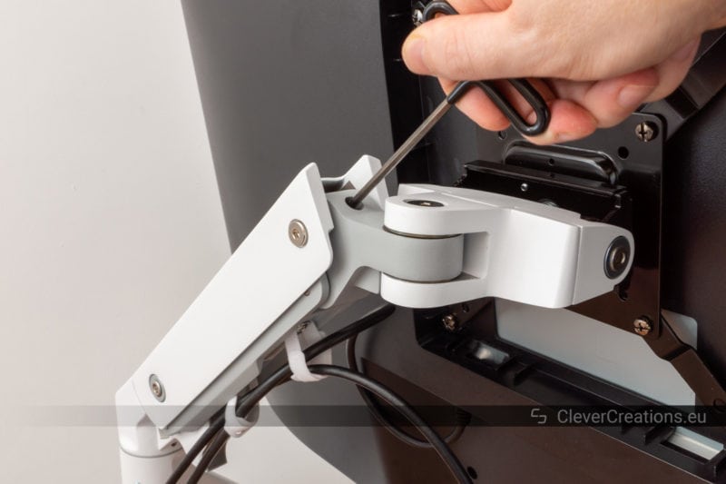 Adjusting the spring tension of the Ergotron HX.