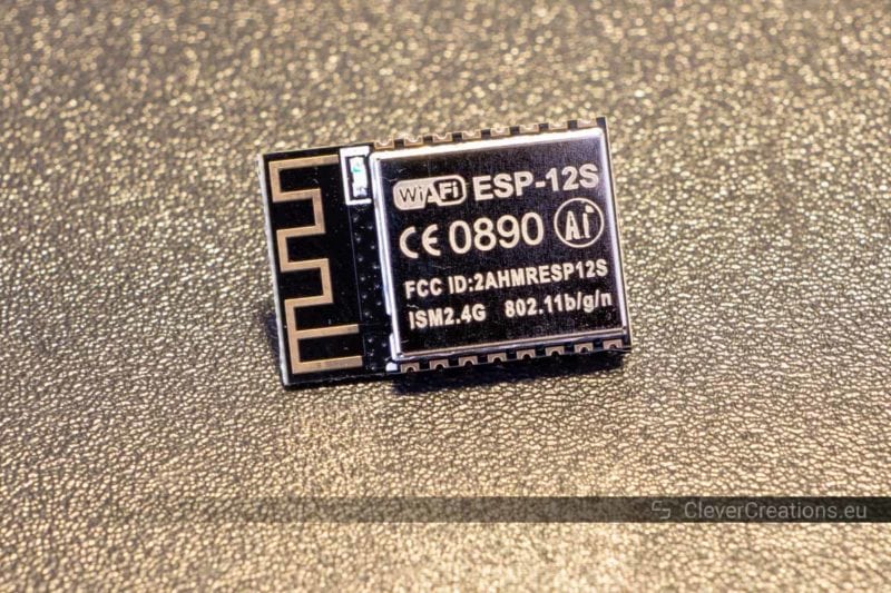 An ESP-12s Wifi module placed on a neutral background.