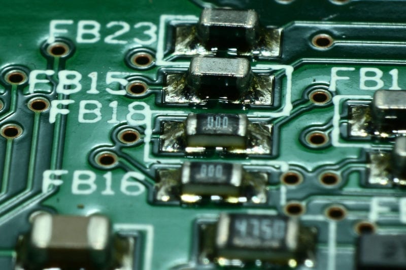 A close-up of a collection of SMD components on a printed circuit board.