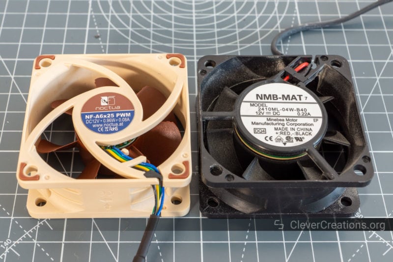 A silent Noctua NF-A6x25 PWM fan placed next to a 2410ML-04W-B40 fan, both placed flat with their labels facing up.