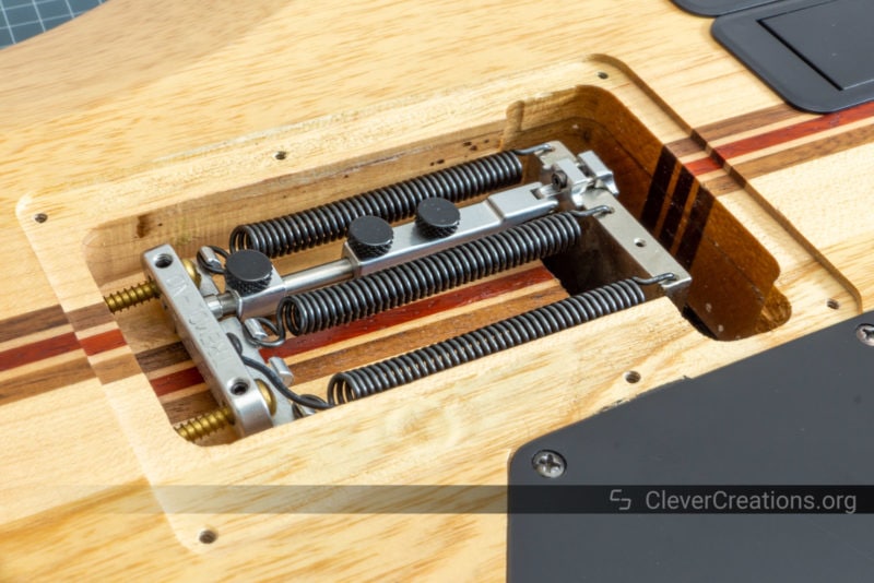 A Tremol-No locking system inside of an electric guitar tremolo cavity.
