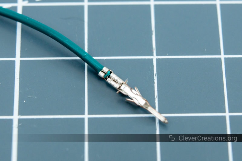 Close-up of a crimped Molex Microfit 3.0 contact with AWG 24 wire.