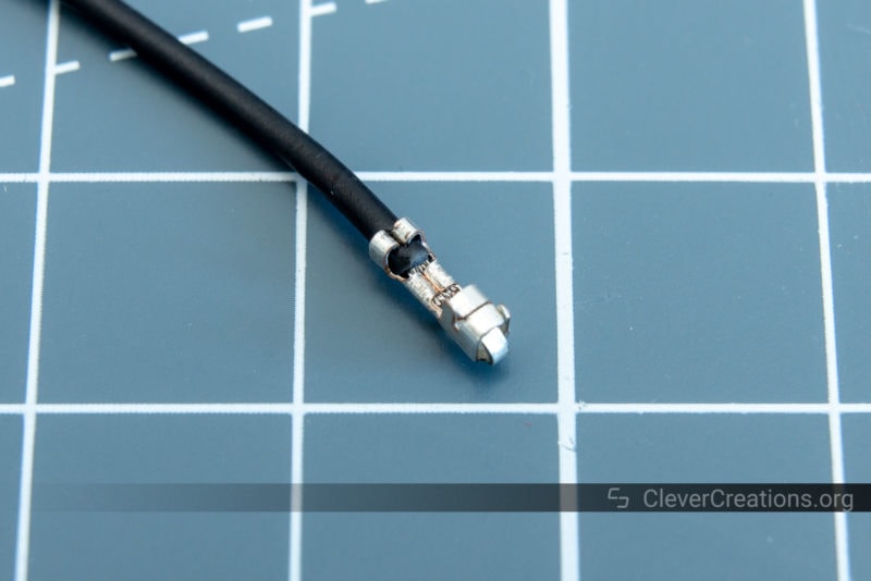 Close-up of a crimped JST-XH terminal with AWG #28 wire.