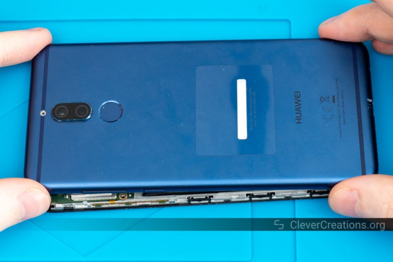 The back shell of a Huawei Mate 10 Lite placed onto the phone.