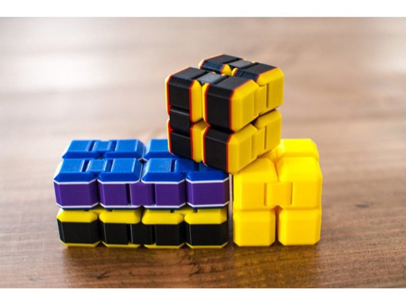 Several multicolor cube fidget toys