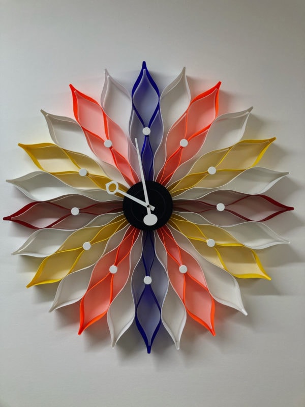 A colorful wall-mounted sunflower clock