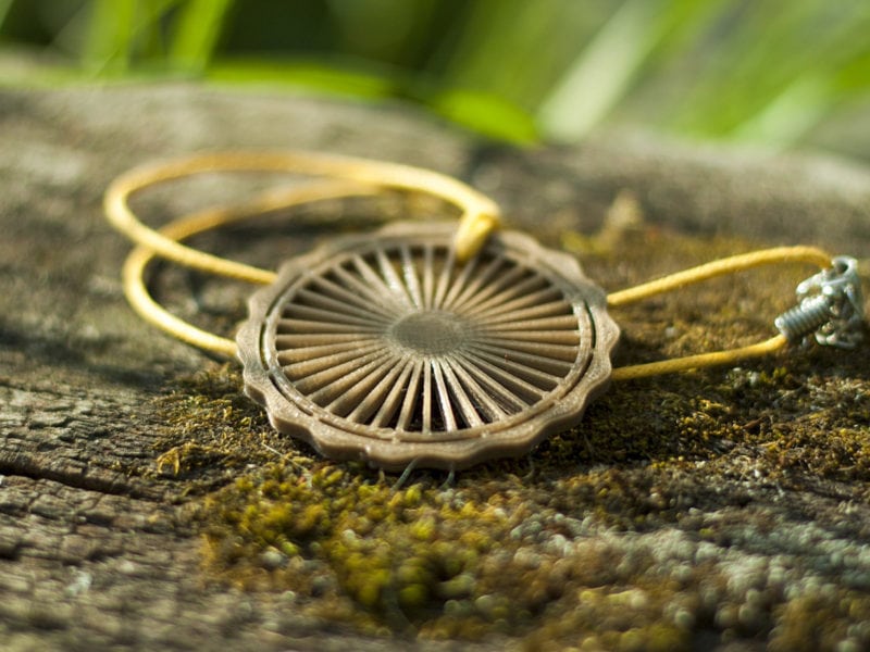 A 3D printed jewelry pendant that can be sold.