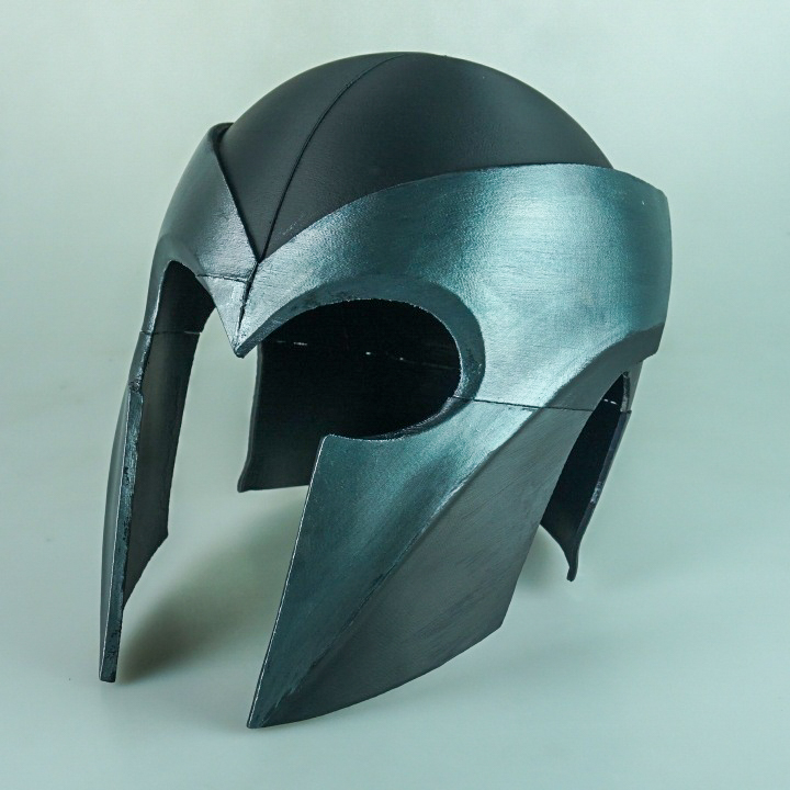 A black Magneto helmet that has been assembled from multiple 3D printed split pieces.