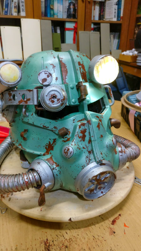 A painted Fallout helmet with rust features