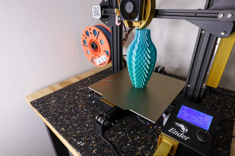 A blue vase on the print bed of an Ender 3
