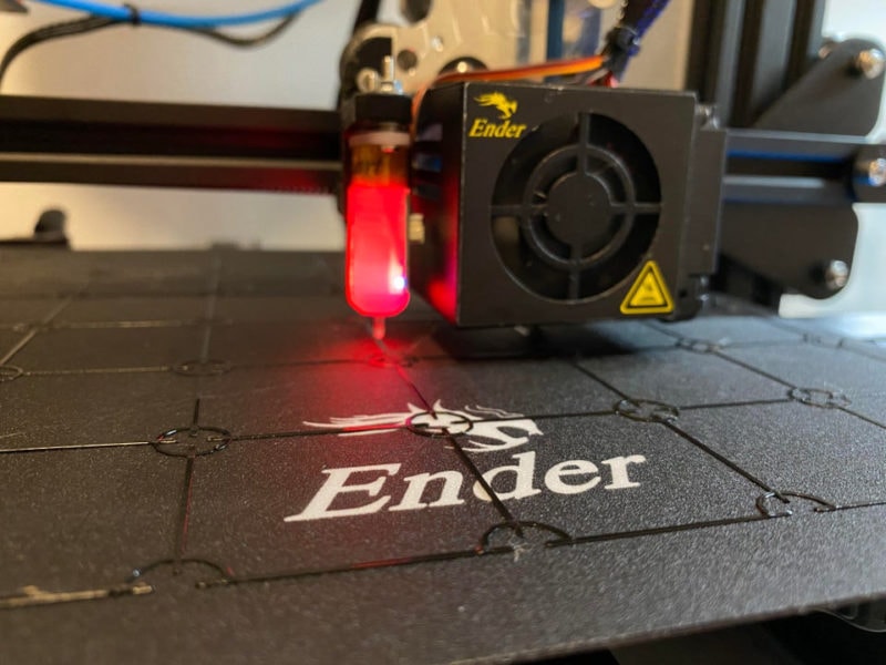A BLTouch sensor probing a grid to determine print bed slope