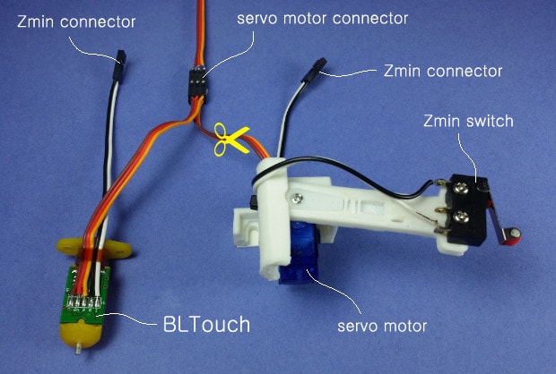 A micro-servo + arm + microswitch leveling solution next to a BLTouch
