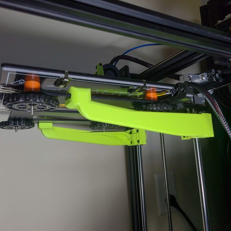A green 3D printed Ender 5 bed support upgrade