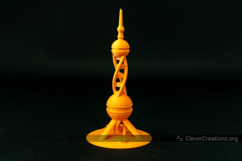 An orange 3D printed calibration tower