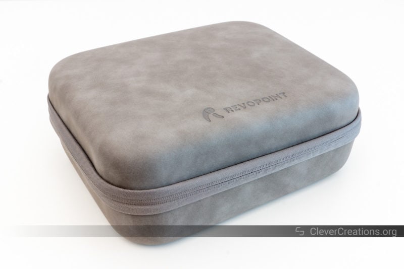A closed grey clamshell storage case with a logo and Revopoint embossed on its front