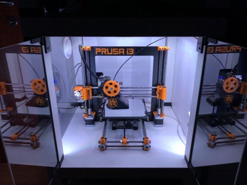 A Prusa i3 3D printer in an enclosure