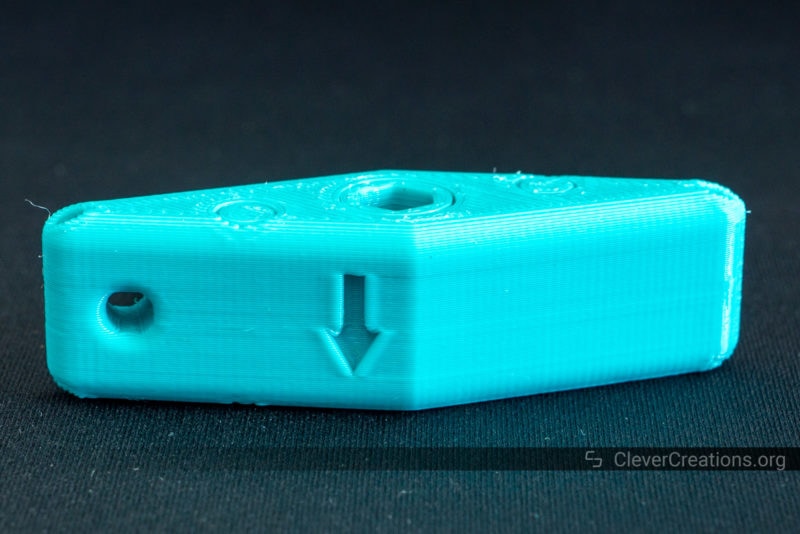 A 3D printed print-in-place ratchet screwdriver in blue PETG on a black background