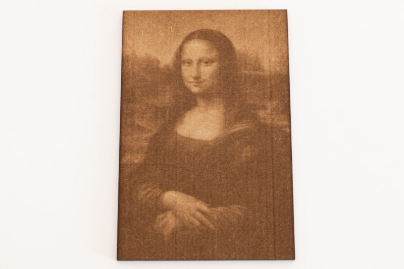 A laser engraving of the Mona Lisa painting on MDF wood