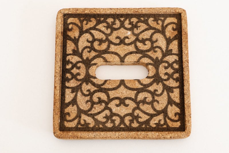A decorative pattern laser engraved on a cork coaster