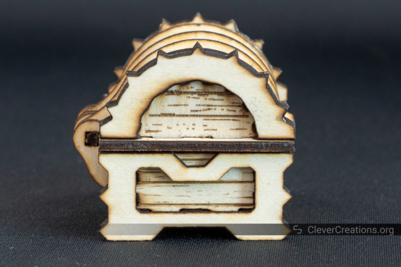 Side view of a laser cut mini chest with engraving