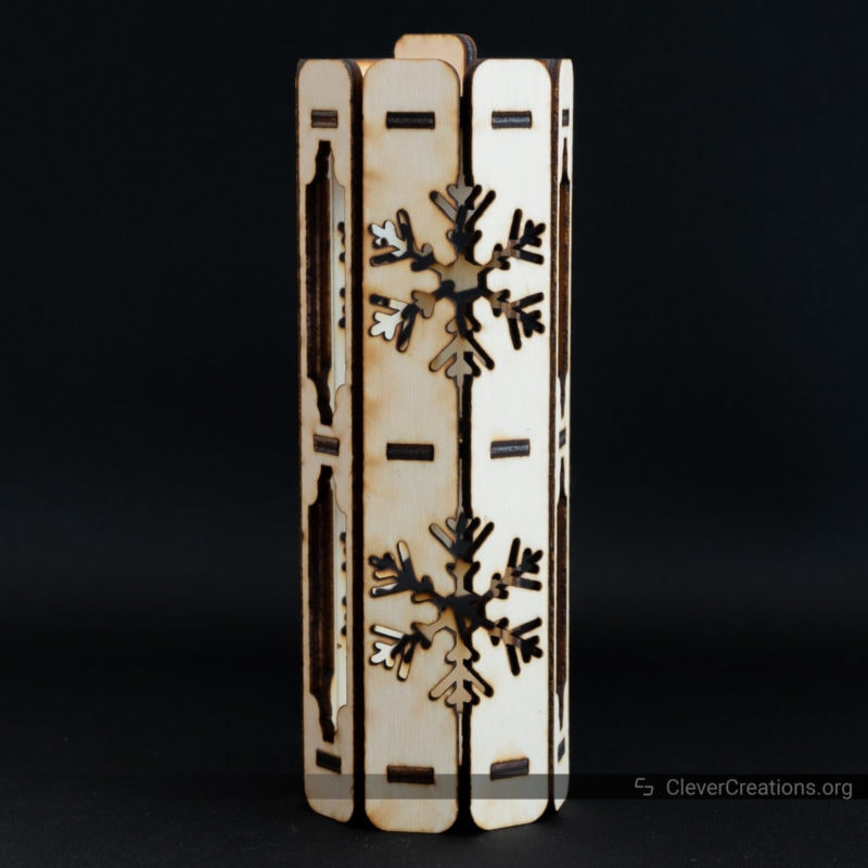 A laser cut gift box with a snowflake pattern on it