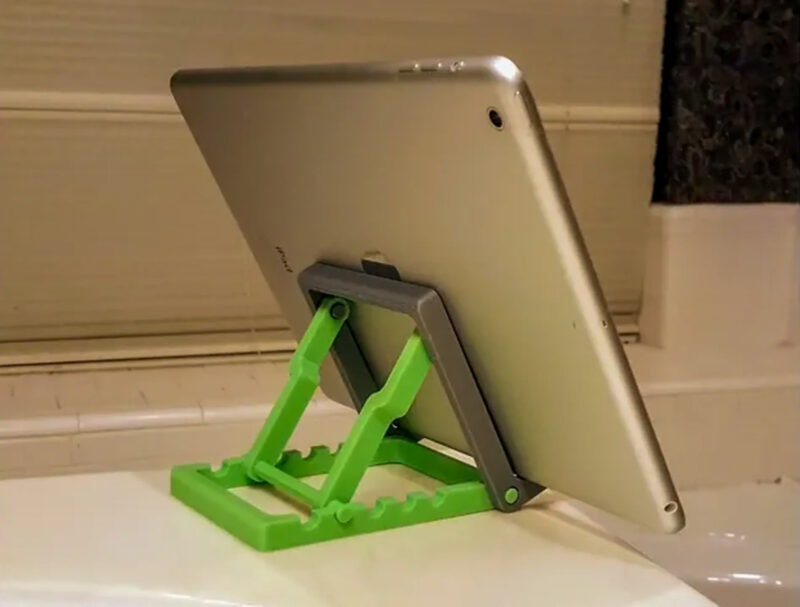 A tablet stand with a tablet on it