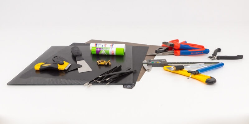 A collection of 3D printer accessories and 3D printing tools on a white background