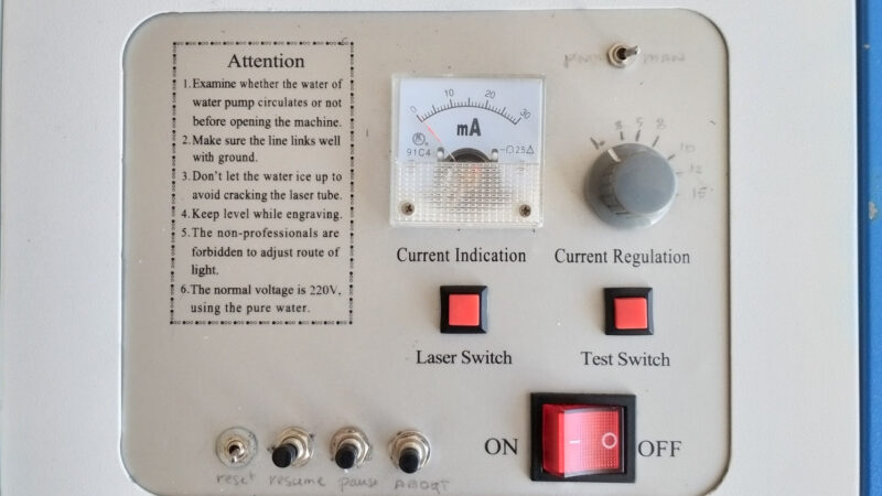 A mA meter, power button, and various buttons and switches on a K40 interface