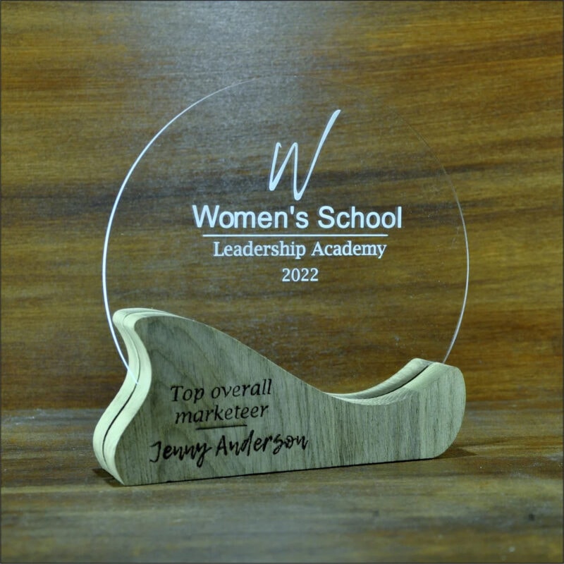 An acrylic and woood laser cut custom Women's School award