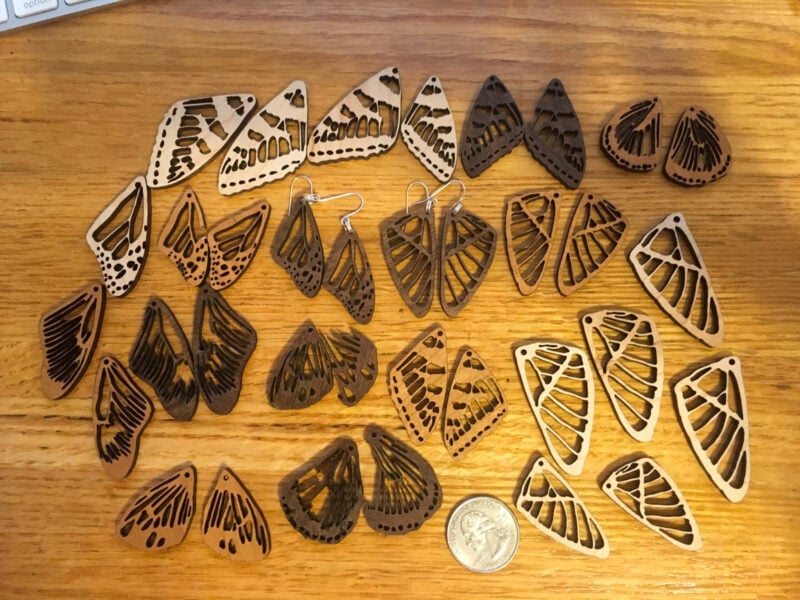 A large number of laser cut project butterfly earrings