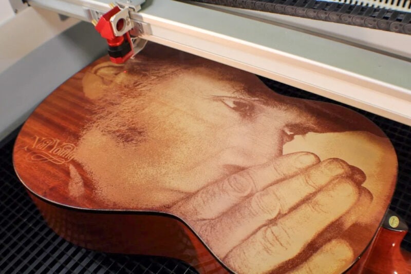 A Neil Young engraving made with a CO2 laser engraver on the back of a guitar