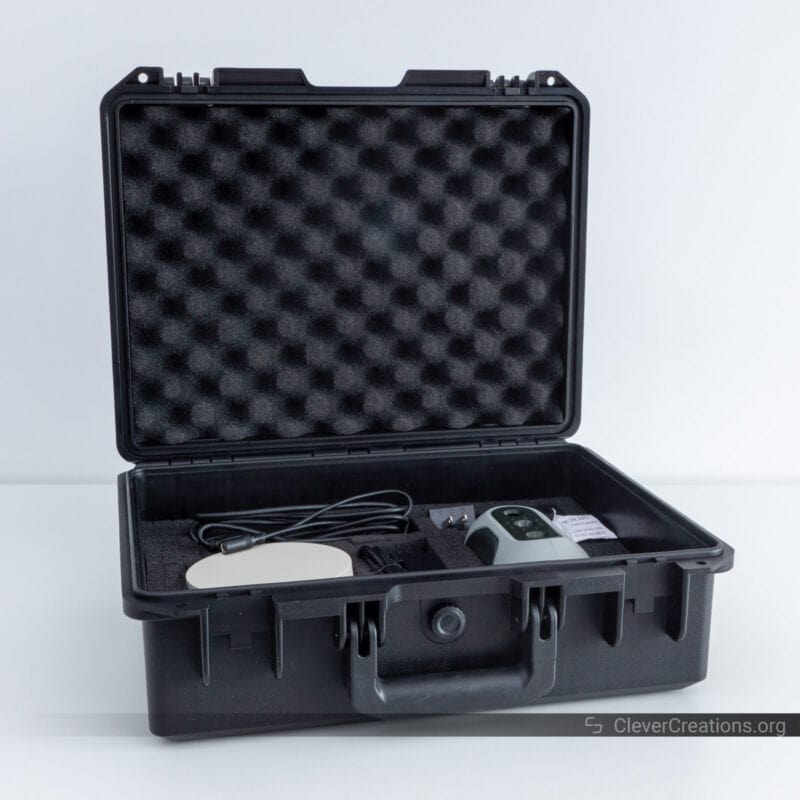 An open foam-padded case containing components for the Mole a 3D scanner