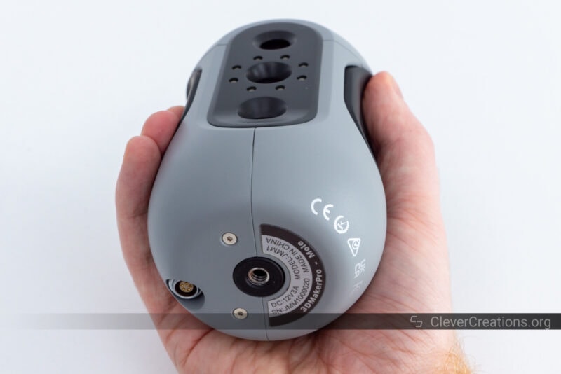 A hand comfortably holding the 3DMakerPro Mole 3D scanner