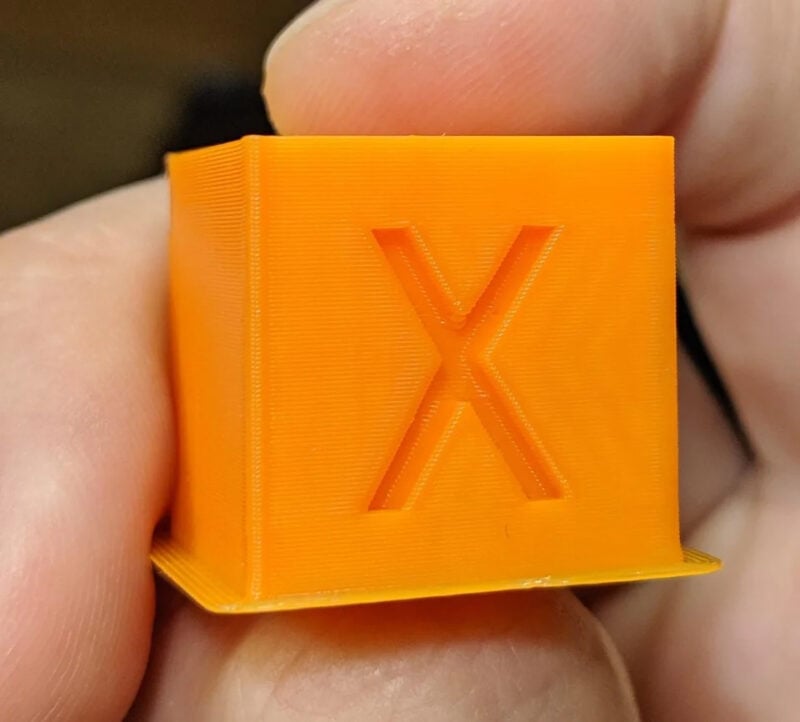 A calibration cube 3D printed with Klipper firmware and linear advance