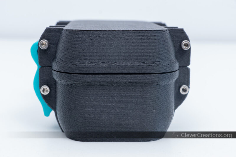 A black 3D printed rugged box with blue hinges