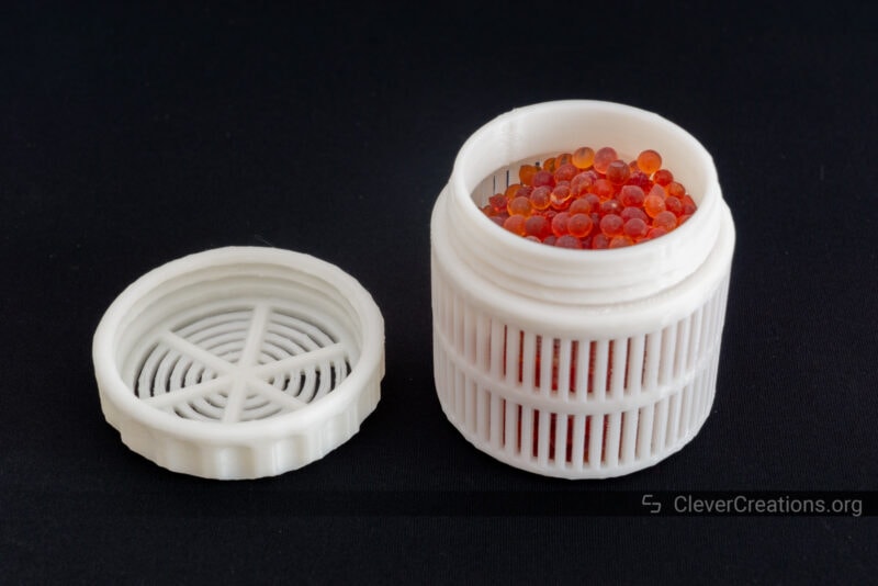 A white 3D printed container with dessicant