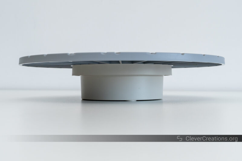 A turntable with large grey surface used for 3D scanning