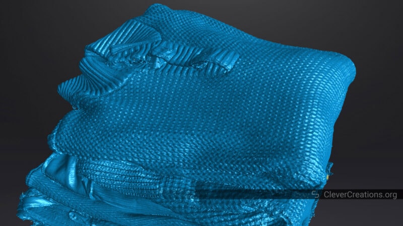 A screenshot of a 3D model of a stack of clothes