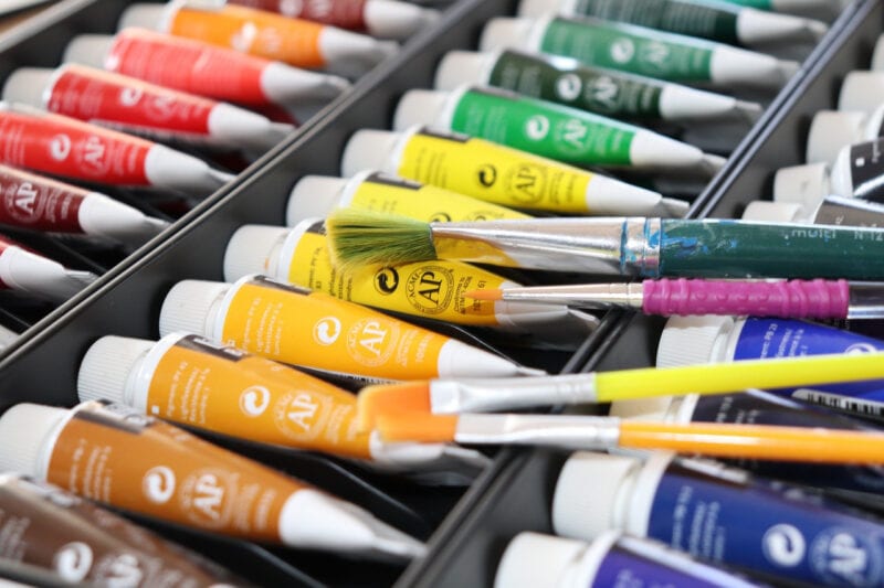 Various acrylic paints and brushes for painting PLA
