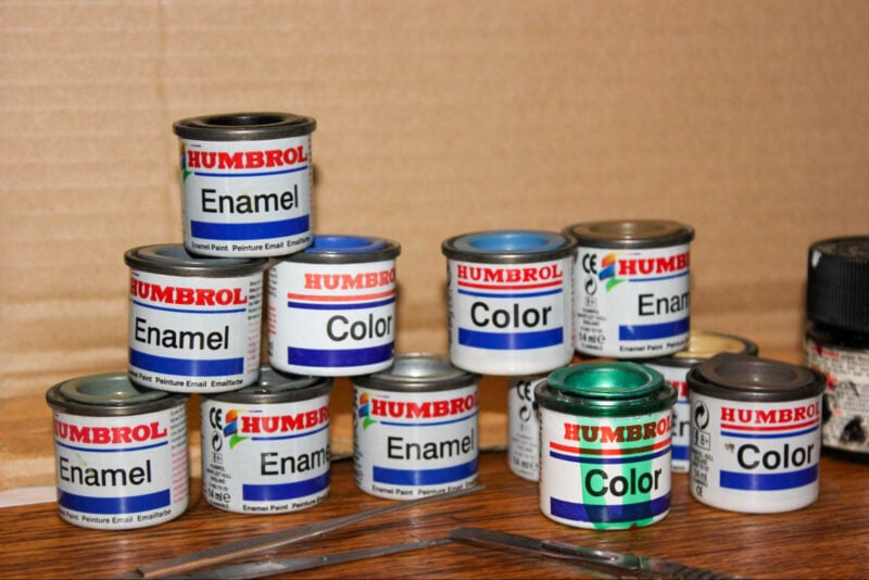 A collection of stacked enamel paint cans