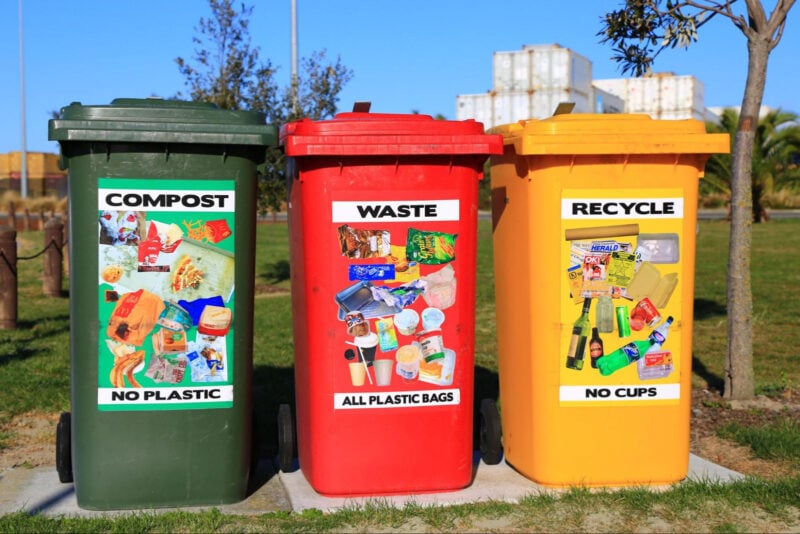 A compost, waste, and recycle bin next to each other