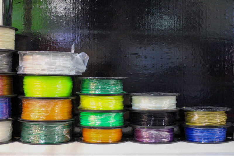 Various spools of biodegradable PLA stacked on top of each other