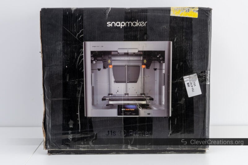 The box of the Snapmaker J1s 3D printer on a table