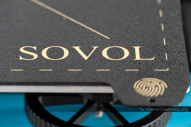 A close-up of a black print surface with 'Sovol' logo visible