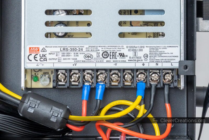 A close-up of the electrical connections on a LRS-350-24 power supply unit.
