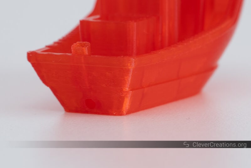 A red 3D printed benchy with layer shifting