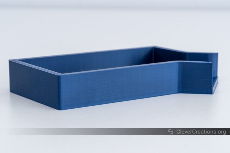 A blue ABS 3D print of a parts tray